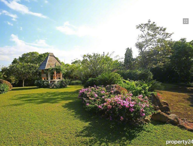 Sprawling greens by the beach? This home is making my heart soar.